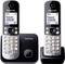 Two cordless Panasonic telephones with display, showing telephone number '1234567890', keypad, base station.