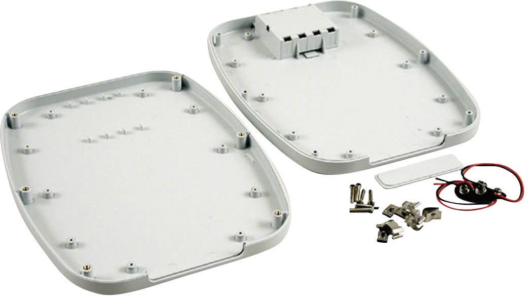 An open chassis with multiple screws and electrical components for assembly.