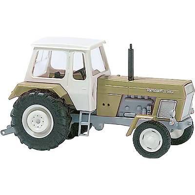A model tractor in brown and white with three wheels is seen from the side.