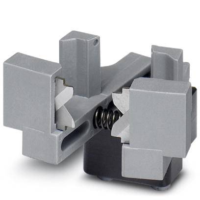 A metallic vice with two opposing, gripping jaws and a central spring mechanism mounted on a black base.