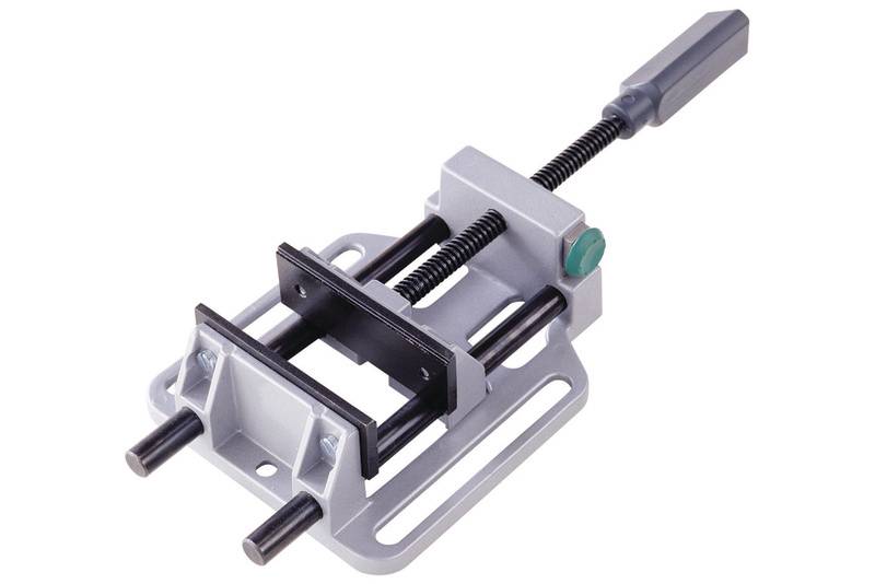 A grey G-clamp with a green knurled knob and two black rails, lying on a white surface.