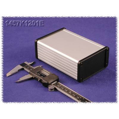 A silver metal casing lies on a blue background. Beside it, a calliper measures the size of the casing.