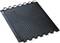 A black, square floor mat with a non-slip surface and interlocking edges, ideal for work areas.