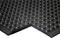 Black anti-fatigue mat with a structured, round-studded surface and bevelled edge, suitable for workplaces.