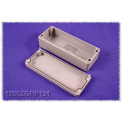 Plastic casing opened, base and removed lid visible, against a violet background.