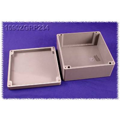 Plastic housing in two parts against a purple background. On the right is the base, on the left is the removed lid.
