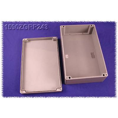 Grey rectangular enclosure, semi-open, on a blue background. On the left is the lid, on the right is the base. Top left reads '1590ZGRP243'.