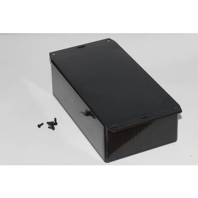 A rectangular, black enclosure with screws beside it on a white background.