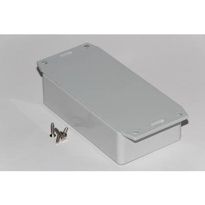 Rectangular grey box with rounded corners, lying on a white surface. Four silver screws are positioned beside it.