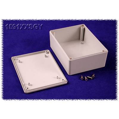 A rectangular grey enclosure with its lid removed rests on a blue surface. Four screws are positioned beside it.