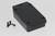 A rectangular, black electronic enclosure with four screws beside it, on a white background.