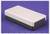 A rectangular, black and white case rests on a purple surface.