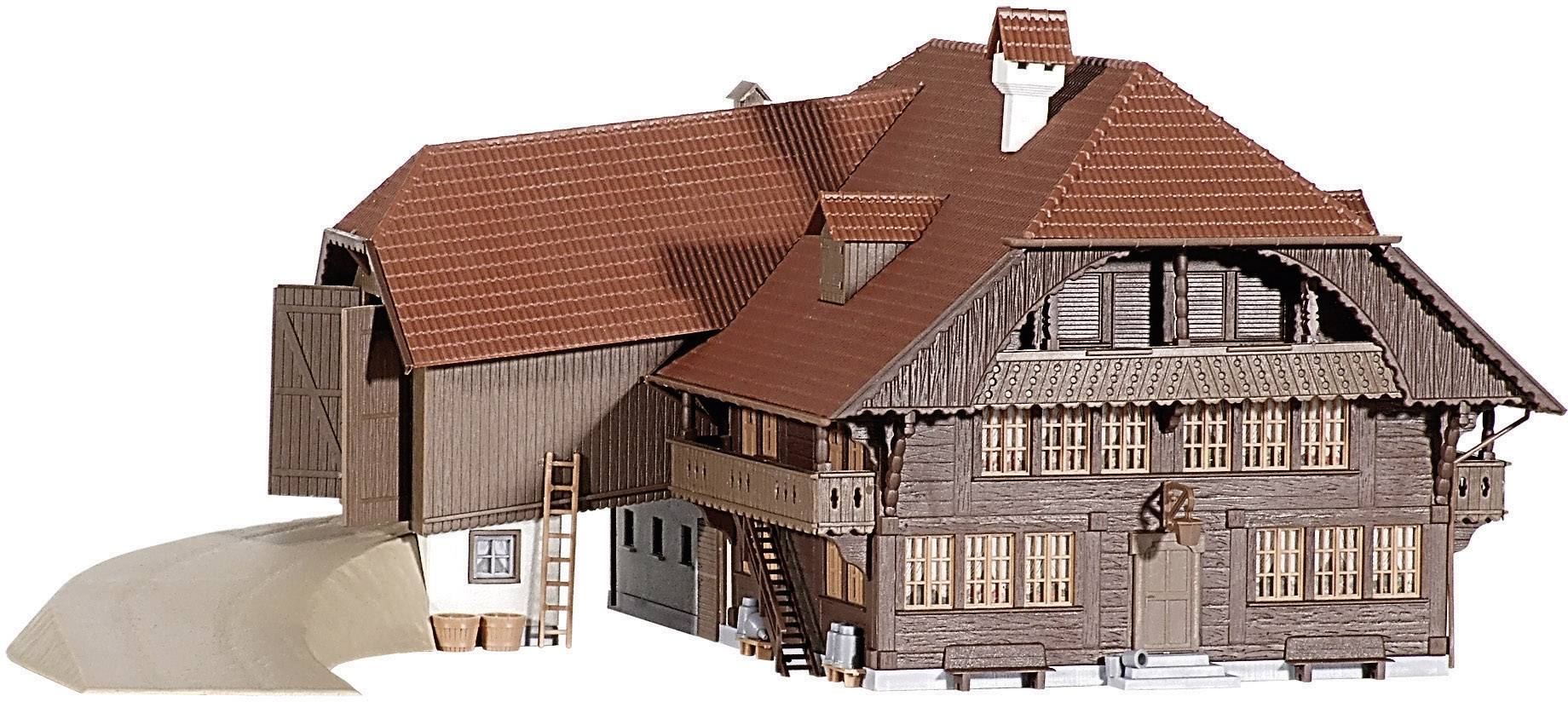 Model of a traditional farmhouse with red roof tiles and wooden beams, comprising a residential house and barn.