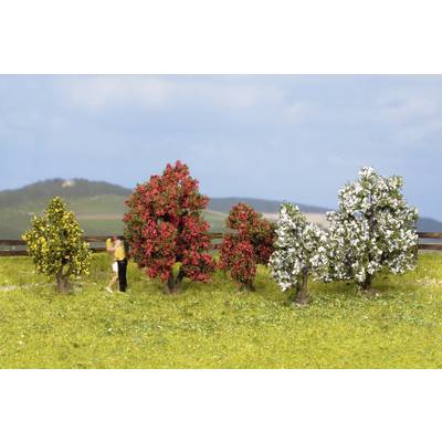 A miniature landscape scene depicts five small trees with colourful blossoms on a meadow. Two figures stand to the left, as if they are taking a walk.