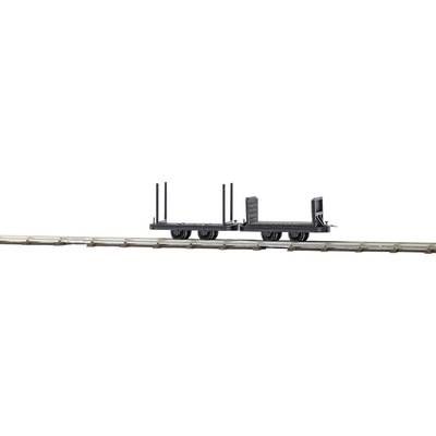 A small, empty model railway goods wagon on rails, without cargo or embellishments, against a white background.