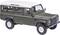 Miniature model of an olive green off-road vehicle with a white roof, four doors, and robust tyres. Side view from the front left.