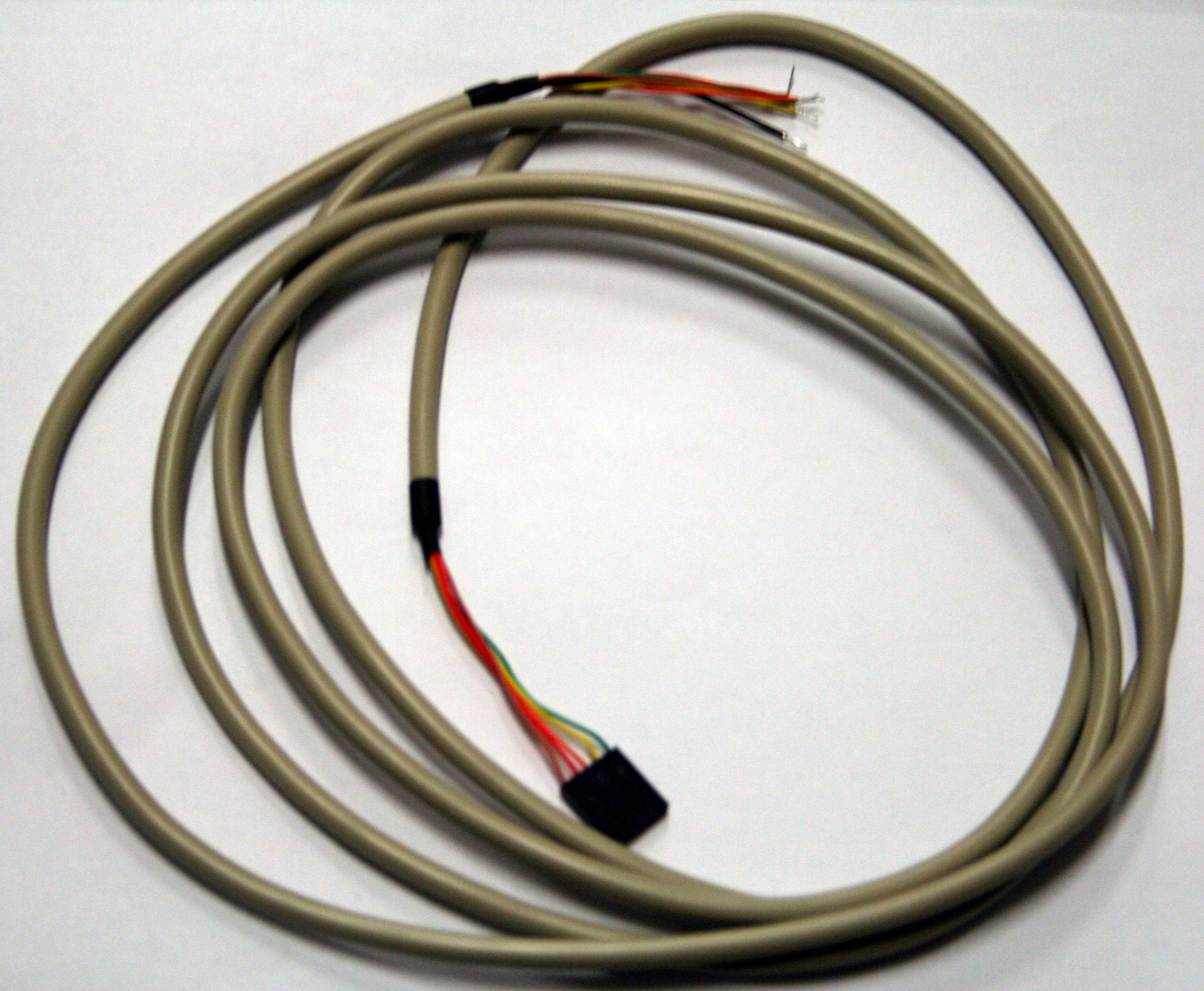 Grey electrical cable with multiple thin coloured wires at one end, on a white surface.