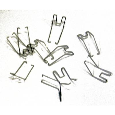 Metal cable clips scattered on a white surface. The clips are U-shaped and used for securing cables.