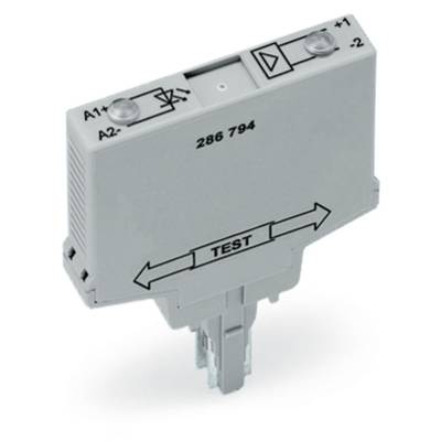 White electrical relay with labels for connections and instructions. Text 'TEST' and directional arrows visible at the bottom.