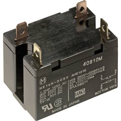 Electrical relay cube with multiple metal terminals, labelled with voltage specifications and manufacturing information.