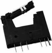 A black, rectangular connector with multiple connection pins and an open, hinged cover attachment.