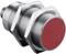 Cylindrical metal sensor with red endpoint, thread and two nuts, suitable for industrial applications.