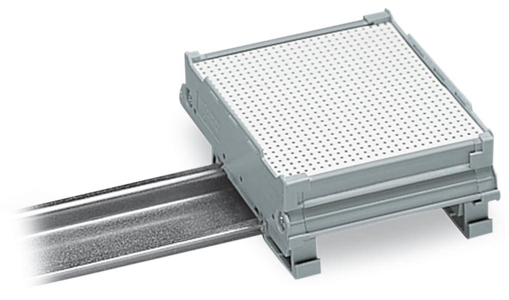 A grey, square metal device is mounted on a horizontal rail. It displays a perforated surface.