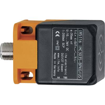 A rectangular, electronic sensor with an orange casing and black labelling, displaying technical specifications and connection details.