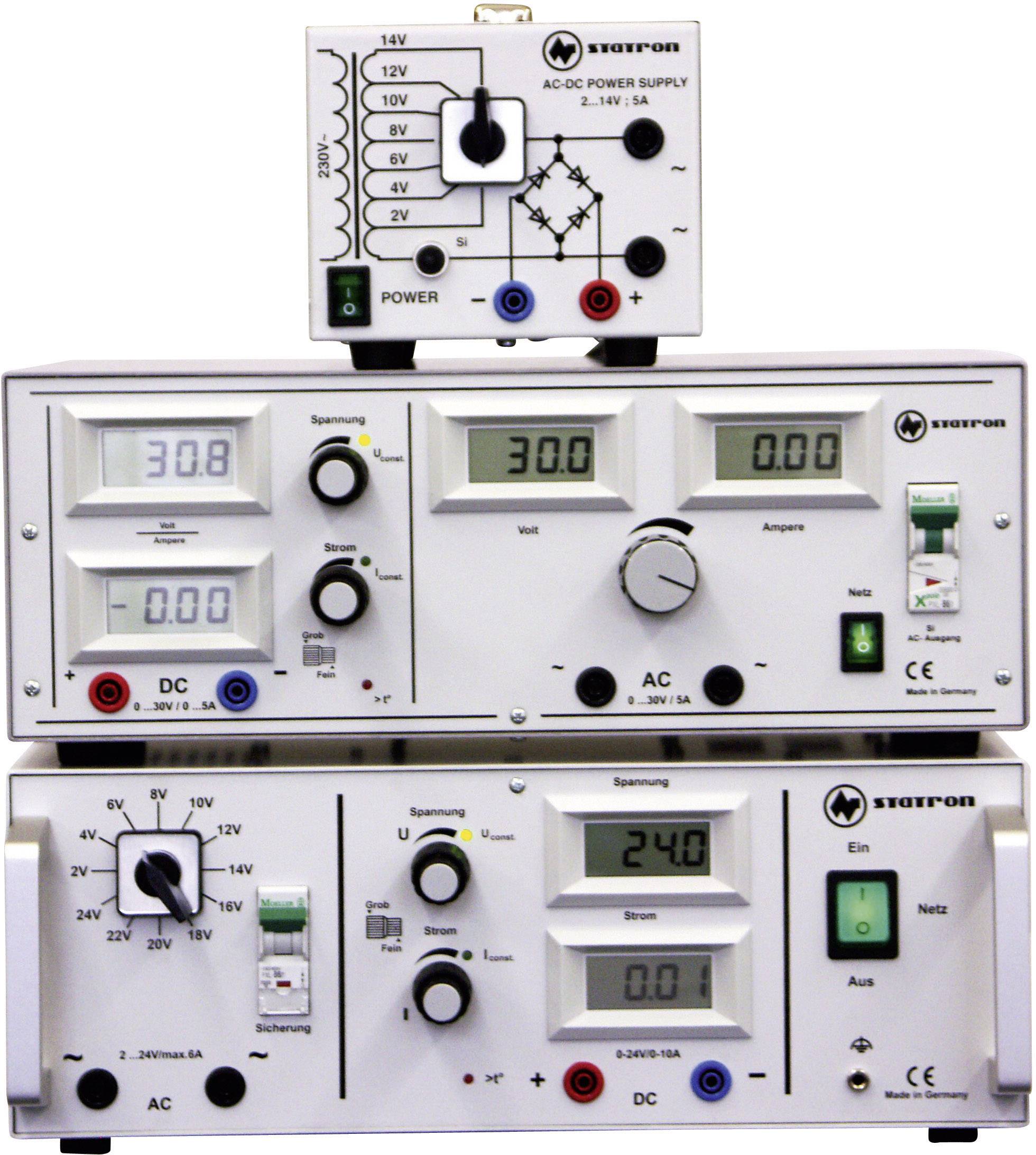 'Three electronic devices for voltage and current supply, with digital displays for volts and amperes, adjustment knobs, and power switches.'