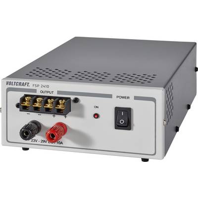 A grey direct current source with the label 'VOLTCRAFT FSP 2410'. It has connections for current output and an on/off switch.