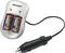 Battery charger with two inserted AA batteries and car adapter cable, brand 'Voltcraft'.