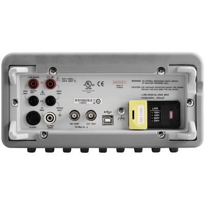 'Rear view of an electrical testing device with multiple connections and switches, including voltage settings and safety warnings.'