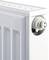 White radiator with side air vent, part of a heating system for room heating.