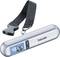 Handy luggage scales with digital display showing 12.6 kg. Black strap with buckle for weighing luggage items.