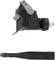 Black mechanical component with lever and rod, likely part of a vehicle or machine.