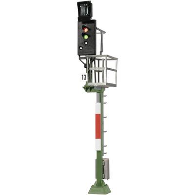 'Railway signal with red, yellow, and green lights. A digital display showing the number zero at the top. Side ladders and platforms.'