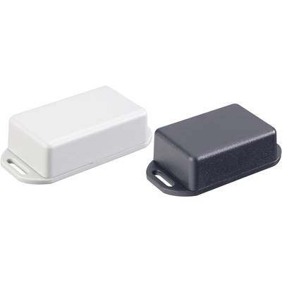 Two plastic casings, one white and one black, are lying side by side. They are rectangular with rounded corners.