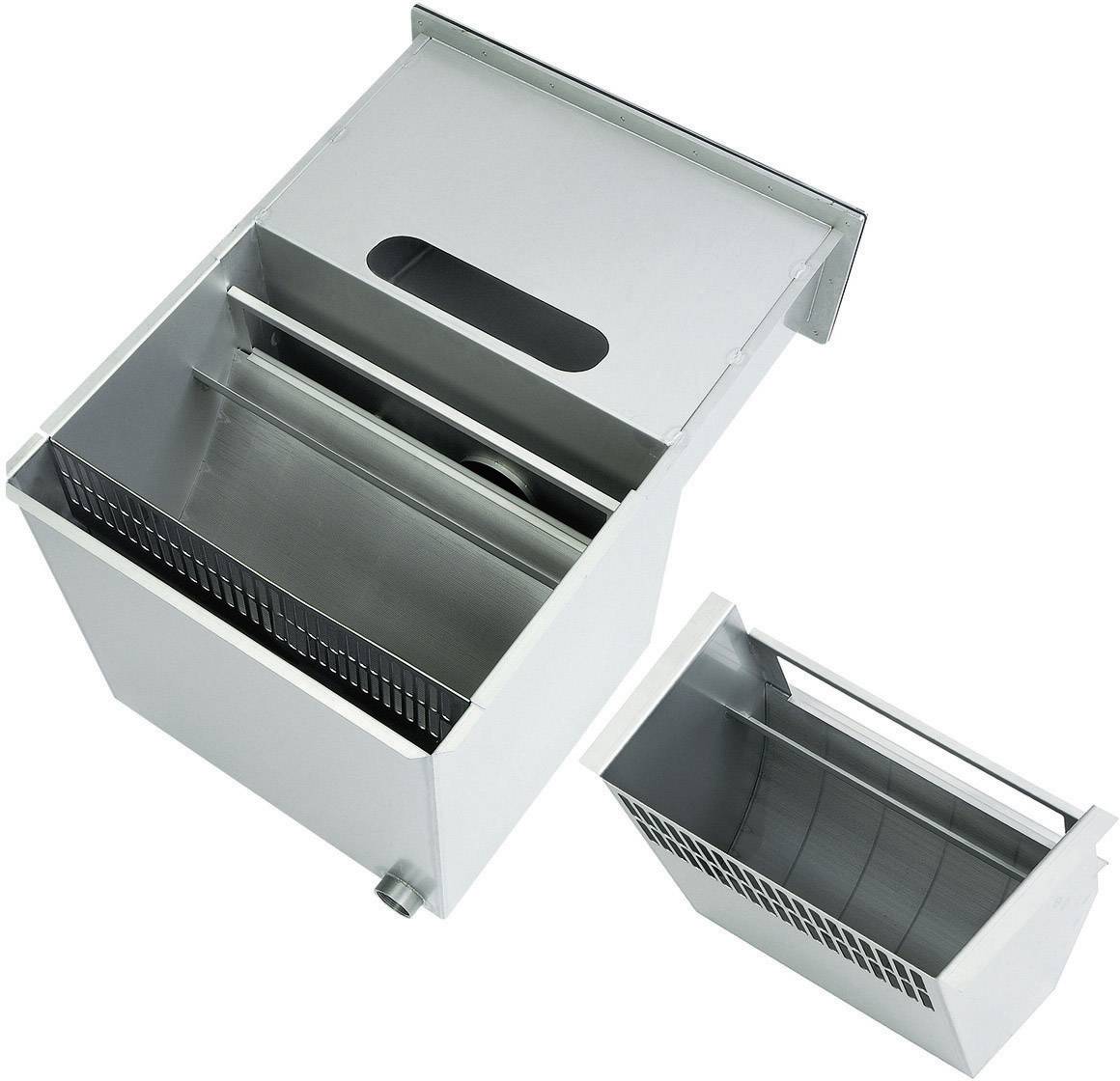 Metallic grease trap with a removable insert, suitable for separating fat and oil from wastewater, commonly used in kitchens.