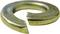A gold-coloured split ring or washer with an open end, showing the typical spiral form to prevent screws from becoming loose.