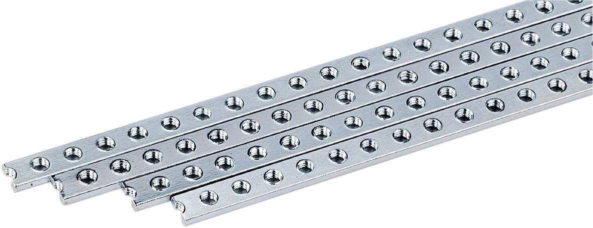 Three silver metal strips with regularly positioned holes, lying on a light background.