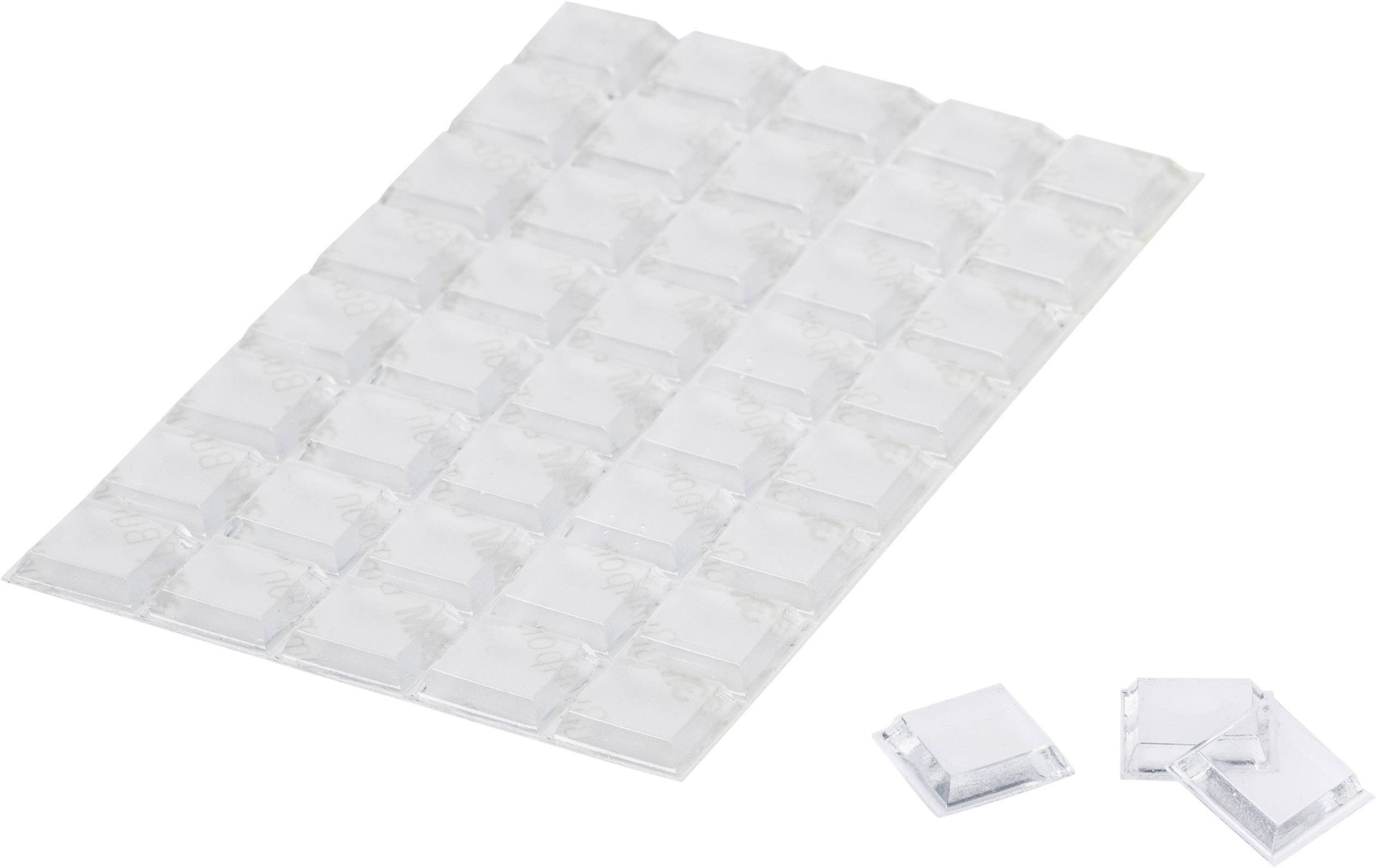 Transparent self-adhesive rubber feet on a sheet, with some detached beside it. Perfect for preventing furniture from slipping.