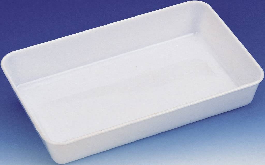 White rectangular dish on a blue background.