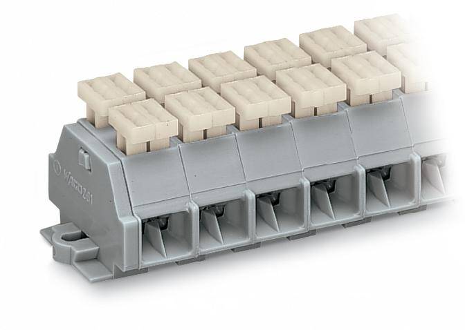 A grey electrical terminal block with multiple ports, fitted with beige covers, for connecting cables.