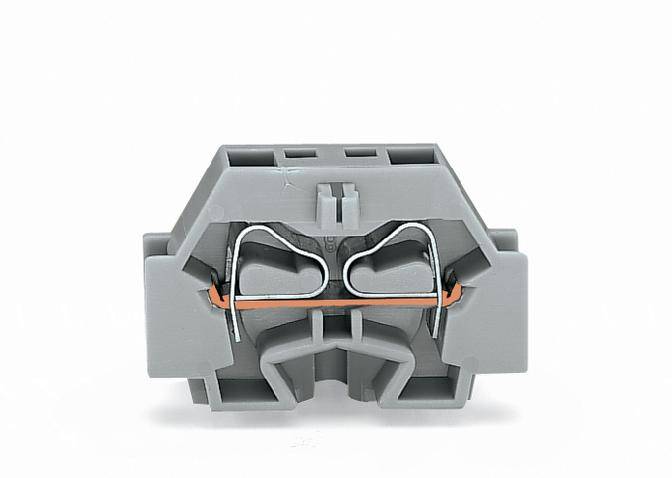 A grey, rectangular electrical terminal block with metallic contacts and an orange cable connection in the centre.