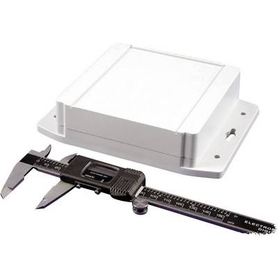 A white rectangular device lies next to a digital calliper. The calliper is measuring the thickness of the device.
