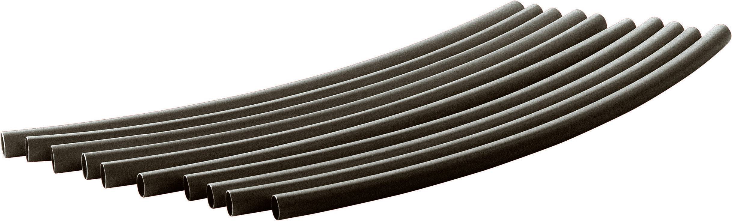 Nine uniform, dark pipes lying side by side in a gentle curved arrangement.