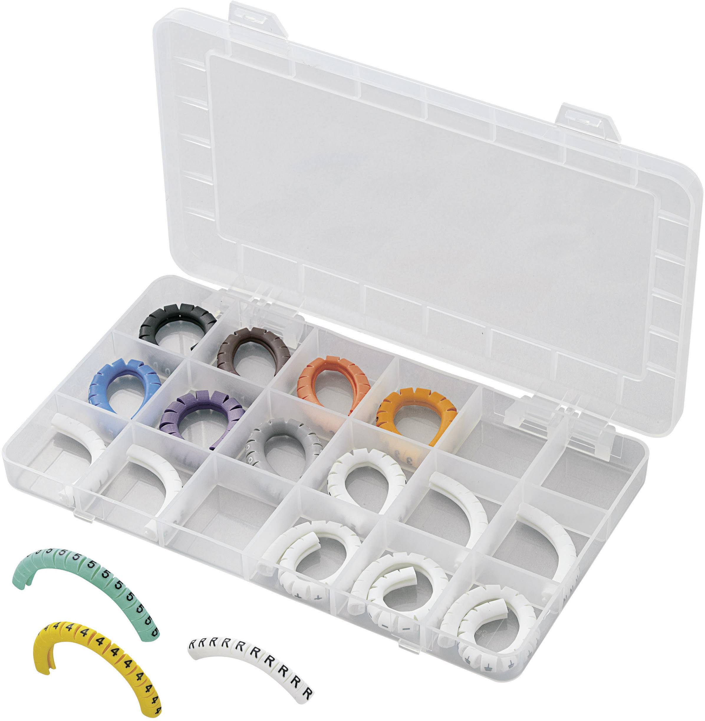 A plastic box with compartments contains colourful, curved objects in various sizes, possibly cable markers, for organisation.