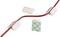 Red cable is secured by white cable holders with adhesive surfaces. An additional adhesive pad is shown.