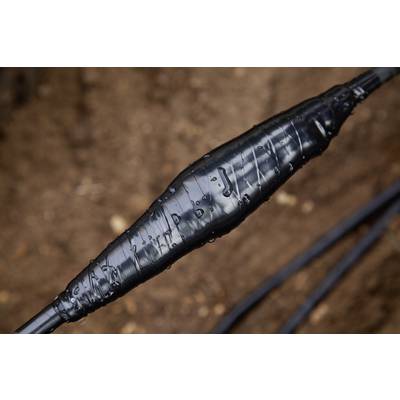Close-up of an electrical cable with an insulating black wrapping, laid outdoors in a wet environment.