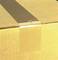 A brown cardboard box with sealed adhesive tape on the top surface.